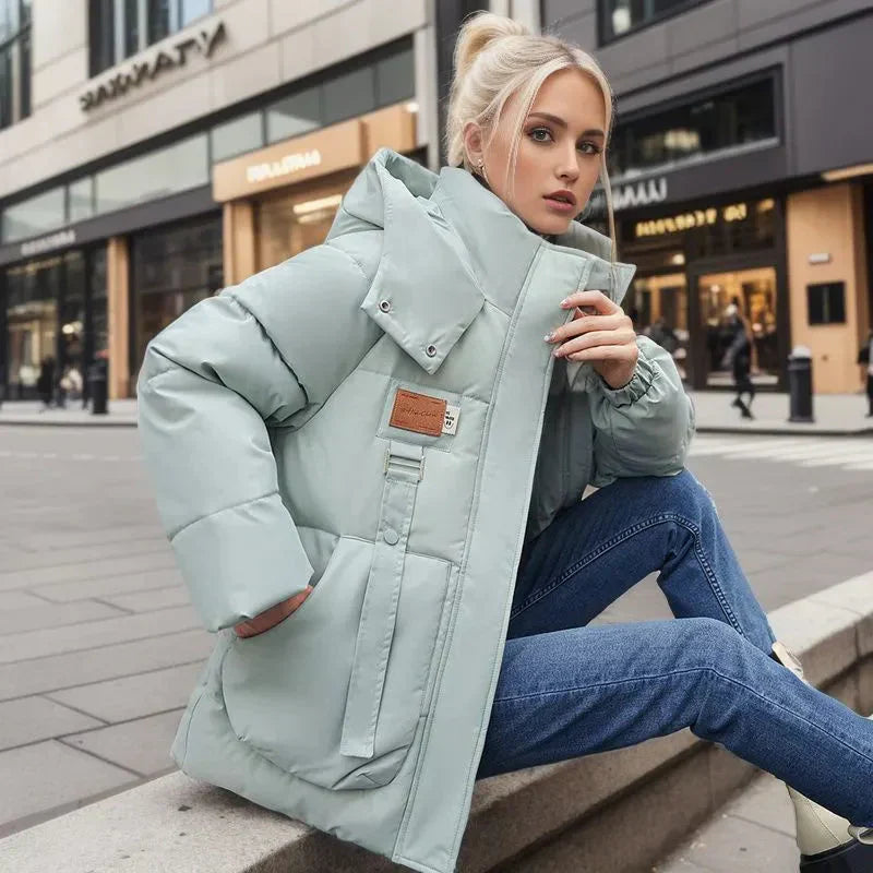 Manteau d’Hiver Femme Imperméable & Matelassé avec Capuche – Chaud, Chic & Résistant aux Intempéries