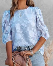 Fiona | Blouse femme blanche – Manches bouffantes & motif floral chic